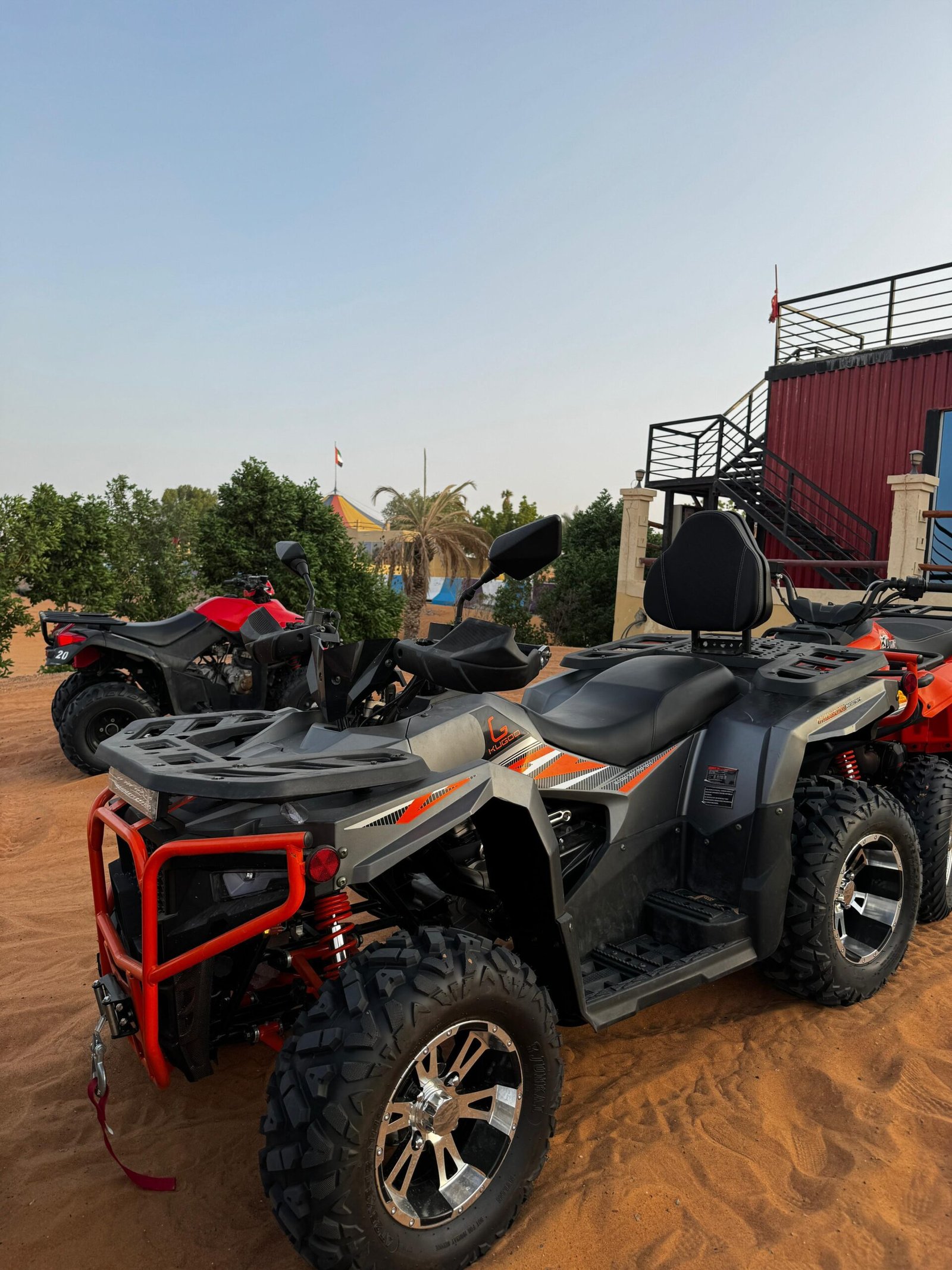 300cc quad lineup beside the desert base camp