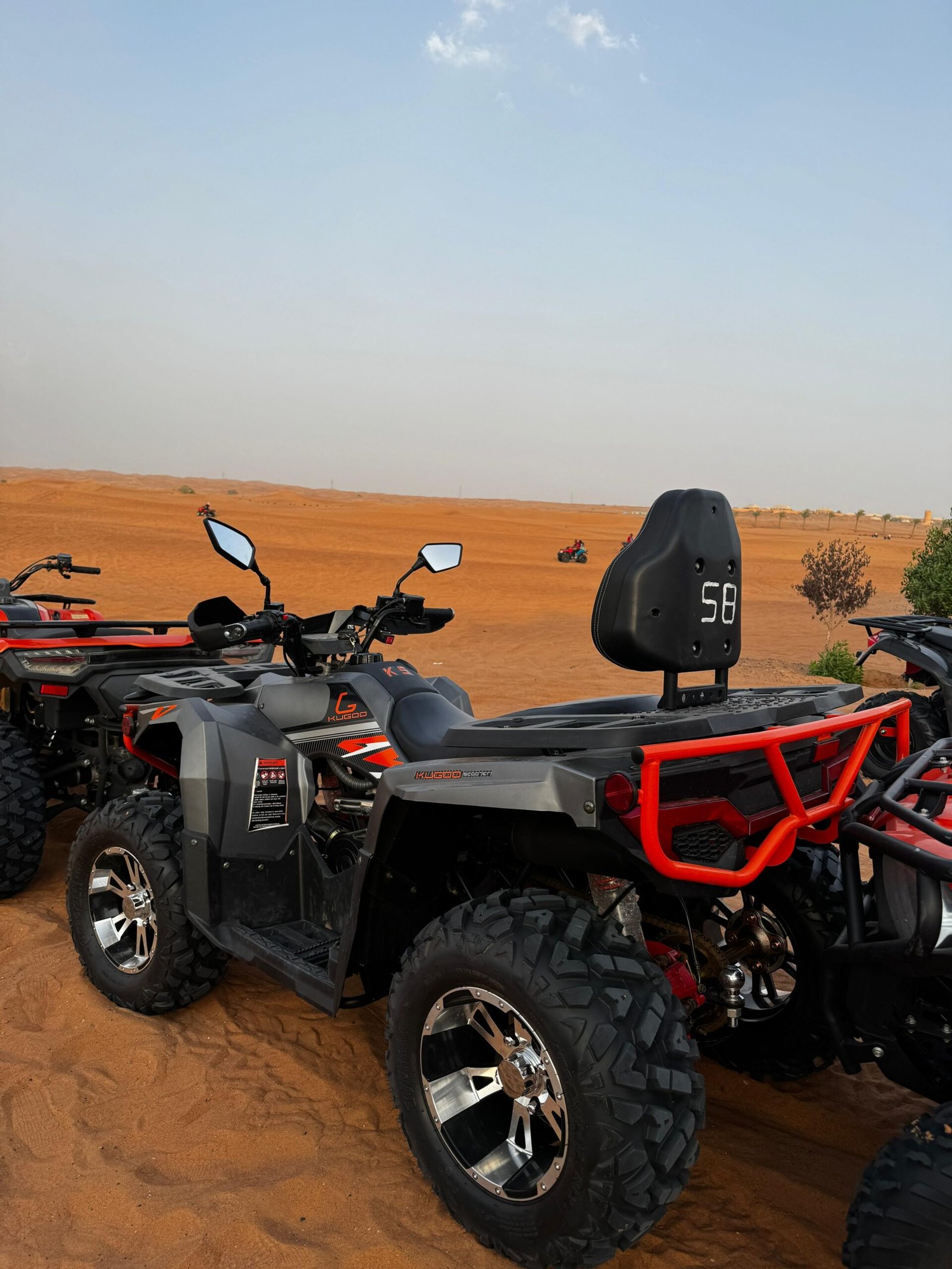 Close-up of a 300cc quad bike on sandy terrain