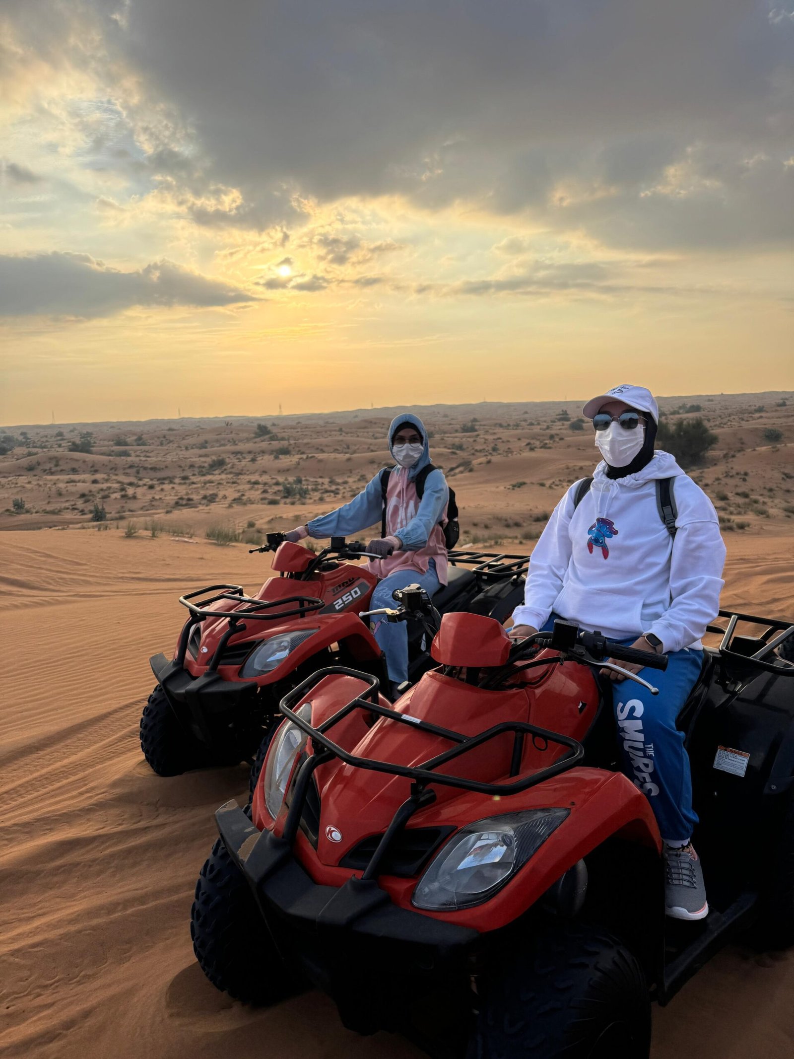 Side profile of KYMCO 250cc quad bike in Dubai desert