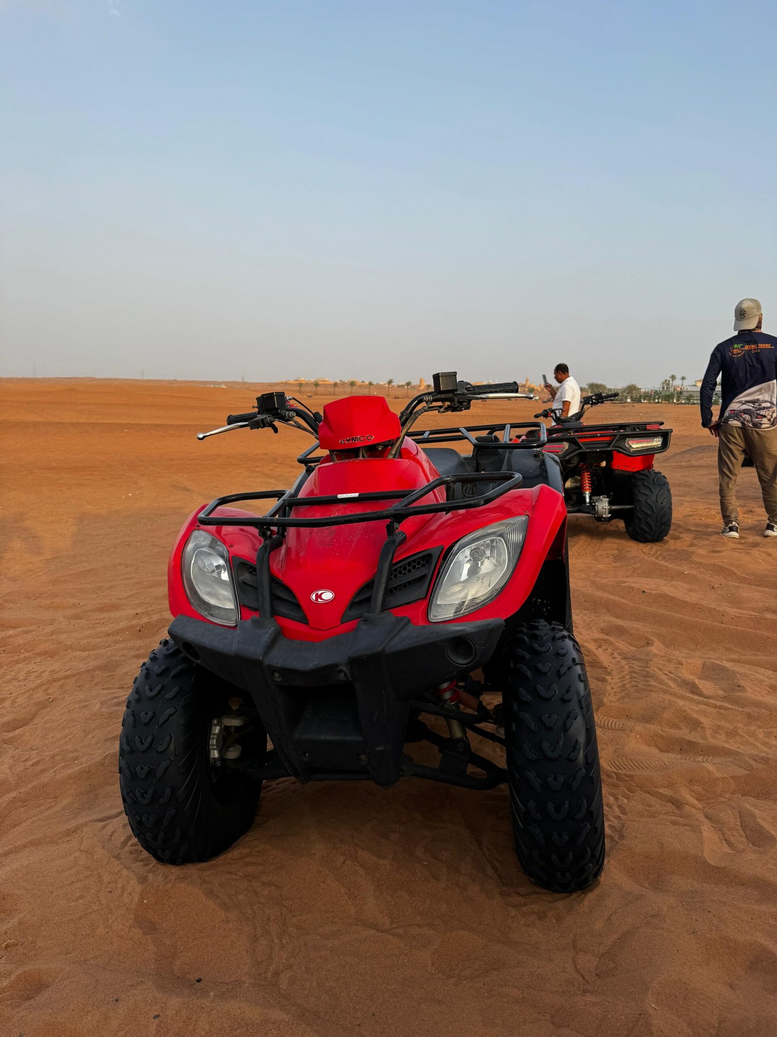 KYMCO 250cc quad bike on golden dunes