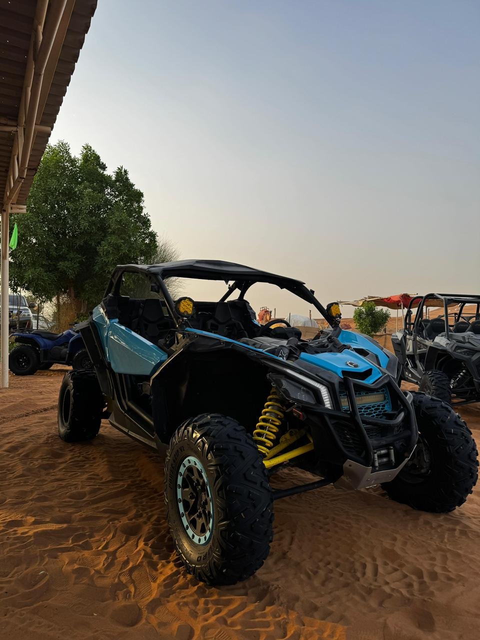 Can-Am 1000cc buggy carving tracks on the sand