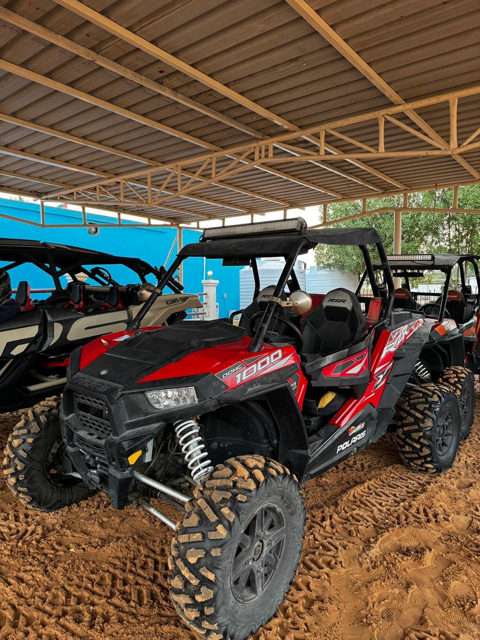 Close-up of Polaris RZR 1000cc buggy with helmets and goggles